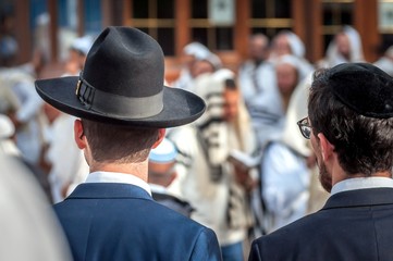 Wall Mural - Two adult Hasidim in traditional Jewish headdresses hat and kippah. Prayer of Hasidim.