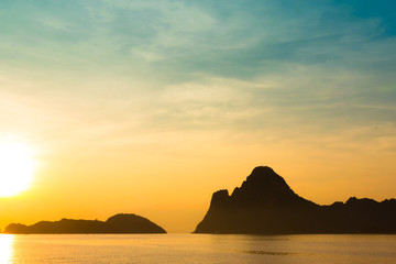 Wall Mural - bright colors at dawn on the beach at sunrise in the gulf of thailand.