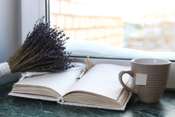 Canvas Print - Vintage notebook on green marble windowsill opened with blank pages and lavender