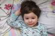 © alexkich - Portrait of a young child lying on a pillow