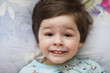 © alexkich - Portrait of a young child lying on a pillow