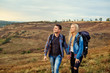 © Studio Romantic - Young couple of tourists with backpacks on the nature.
