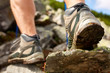 © Aleksey - Hiking man with trekking boots on the trail