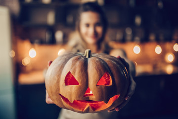 Woman with Halloween pumpkin