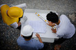 © Blanscape - Top view of Engineer team look paper plan