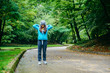 © phpetrunina14 - young pretty woman was interrupted video call while run in the park