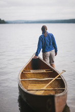 Woman With Canoe