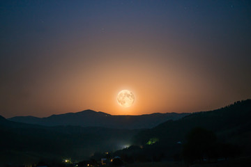 Wall Mural - big moon rising on night sky