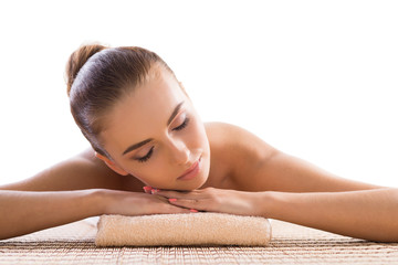 Young, beautiful and healthy woman relaxing in spa salon. Traditional oriental therapy and massaging treatments.