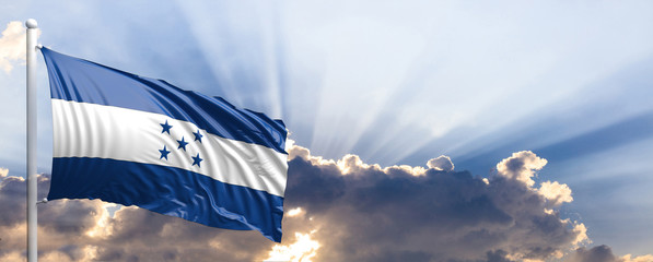 Wall Mural - Honduras flag on blue sky. 3d illustration