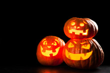 Three Halloween Jack O' Lantern Pumpkins