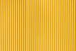 © elxeneize - Yellow corrugated metal sheet background and texture surface