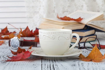 Wall Mural - cup of milk coffee and colorful autumn leaves