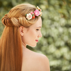 Wall Mural - Portrait of beautiful woman. Flowers hairstyle.