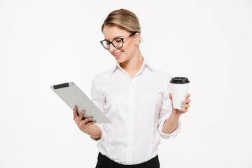 Sticker - Smiling blonde business woman in eyeglasses using tablet computer