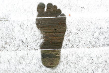 The Imprint Of The Barefoot Feet On Snow