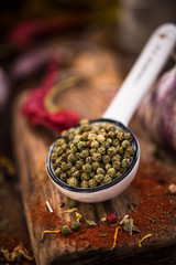 Wall Mural - Green pepper whole seeds on spoon