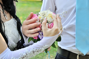 Bride and groom holding hands