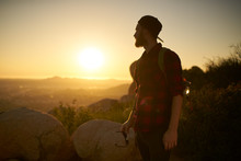 Young Bearded Millennial Man Hiking On Top Of Hill In California Over Looking San Diego At Sunset