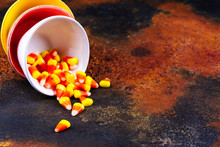 Traditional Halloween Sweets - Candy Corn In Bright Colorful Bowls On Dark Background. Space For Text