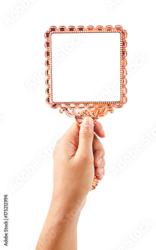 Fotomural Beautiful vintage mirror for makeup in woman hand.