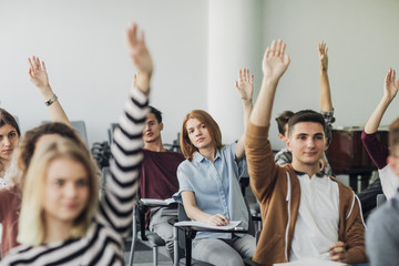 Wall Mural - Students Rising Hands to Answer The Question