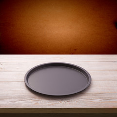 Wall Mural - Empty baking tray for pizza on wooden table close up top view square. Mock up for design