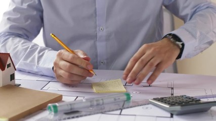 Poster - architect with blueprint and stickers taking notes