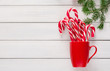 Joyful christmas background with traditional candy cane lollipops
