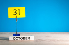 October 31st. Day 31 Of October Month, Calendar On Workplace With Blue Background. Autumn Time. Empty Space For Text