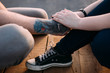 © Photodrive - Tender romantic bound. Couple holding hands. Unrecognizable people communicate together in focus on foreground, urban background. Gentle touch, tenderness concept