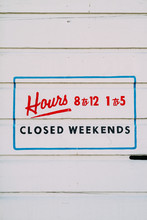 Hand Lettered Sign Showing Business Hours
