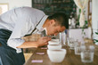 © Maa Hoo/Stocksy - Young man making experiment on coffee and comparing