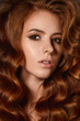© borysenko - Attractive ginger woman with wave hairstyle curly in studio redhead