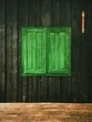 © Paul Schlemmer/Stocksy - green window on old wooden cabin