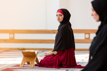 Two Muslim women praying