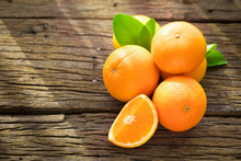 Fresh Orange Fruits On Wood Table.