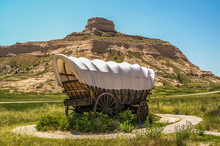 Sunlit Covered Wagon At Scotts Bluff National Monument In Nebraska