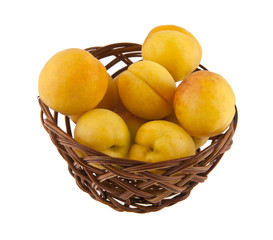 Canvas Print - Apricots in a basket isolated on white background