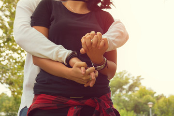 Wall Mural - Couple in love holding hands.