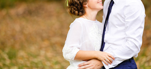 Wall Mural - Luxury married wedding couple bride and groom posing in park autumn