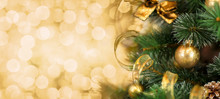 Christmas Tree Branch With Blurred Golden Background