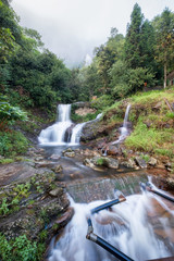 Silver waterfall or Thac Bac on fog in rainy season