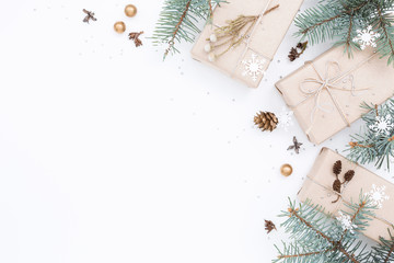 three gift boxes, fir and christmas decorations on white holiday background, new year