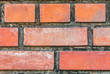 Old brick wall with orange stains. Have light for background or wallpaper.