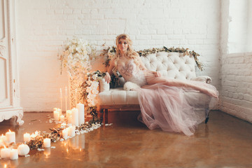 wedding in European style, beautiful couple in the Studio with a small dog