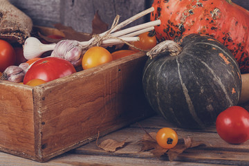 Wall Mural - Fresh vegetables in wooden box on the table