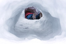 Child In A Snow Tunnel