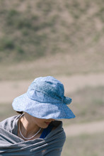 Portrait Of An Attractive, Elegant Asian Woman With A Hat And Sunglasses