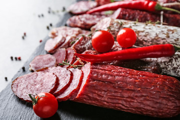 Poster - Delicious sliced sausages on slate plate